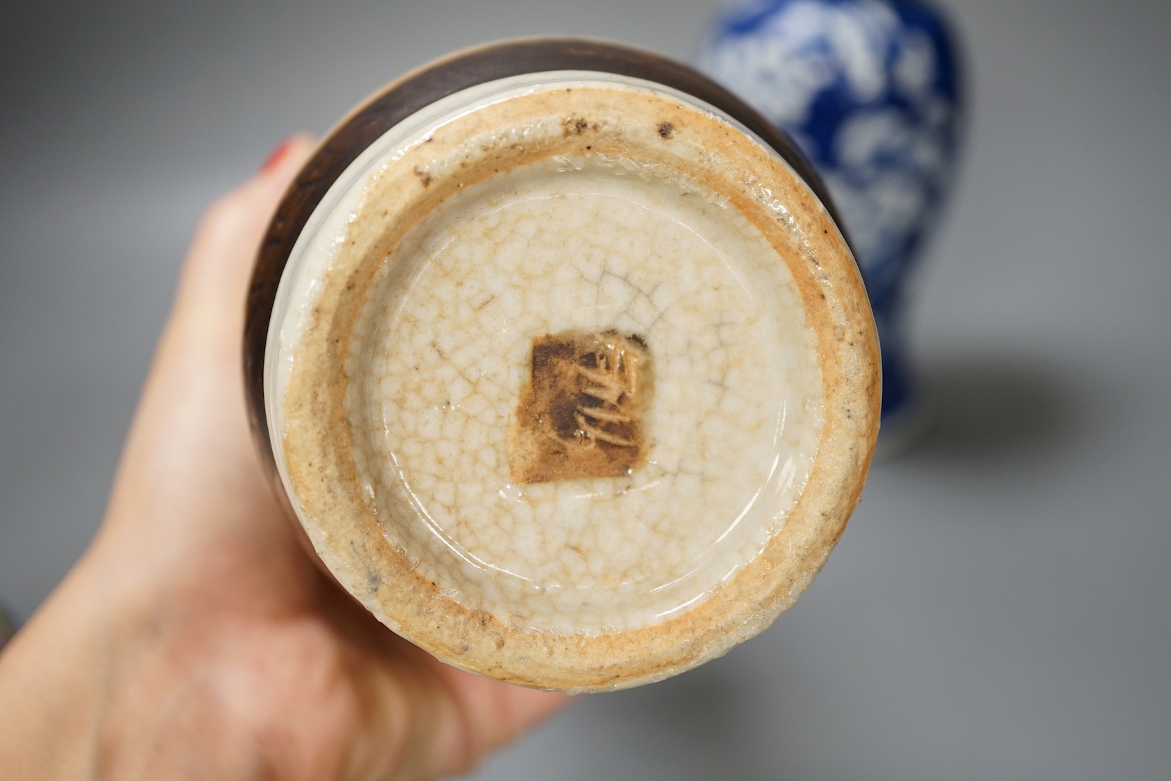 A 19th century Chinese blue and white prunus jar, a crackle glaze vase and a famille rose jar and cover